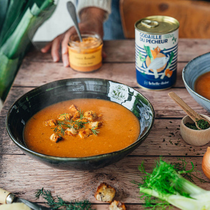 Fisherman's soup with potatoes and baby vegetables